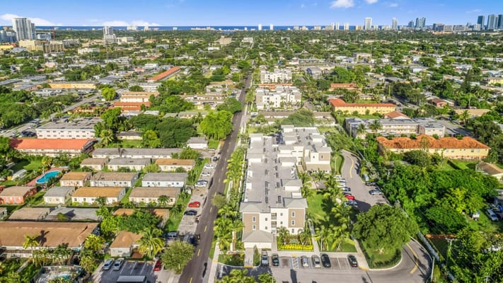 Aerial view of a senior living facility and surrounding area