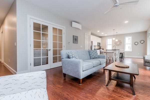 Living room with gray sofa and wooden coffee table