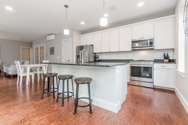 Well-equipped kitchen with a countertop and seating