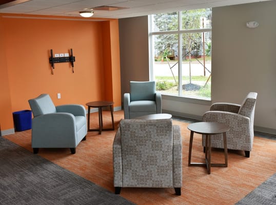Common area with chairs and natural light