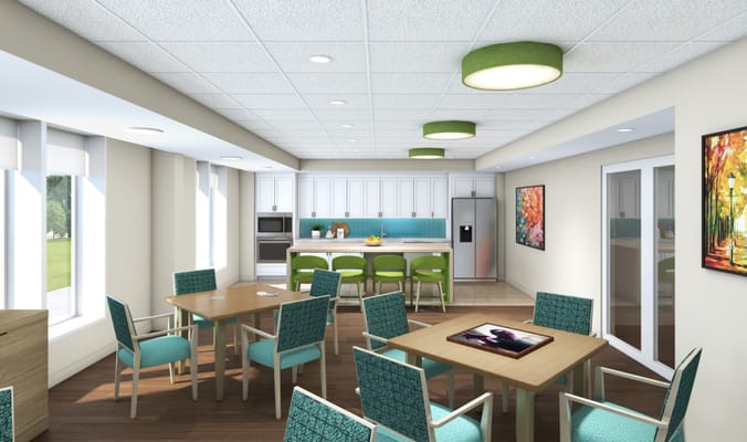 Modern kitchen and dining area with green chairs