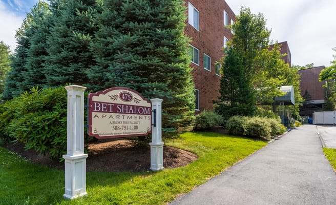 Sign for Bet Shalom Senior Apartments at the entrance