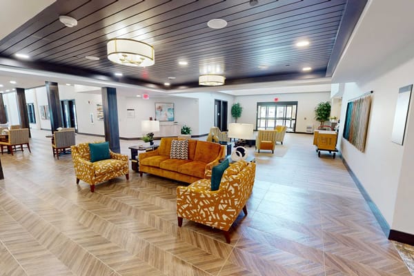 Bright and modern common area with colorful seating