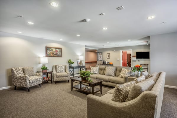 Cozy common area with seating arrangements and plants