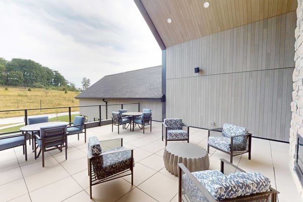 Outdoor patio with seating for residents
