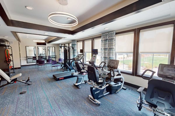 Well-equipped fitness room in a senior living facility