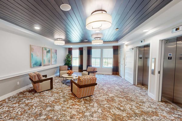 Cozy common area with seating and elevators