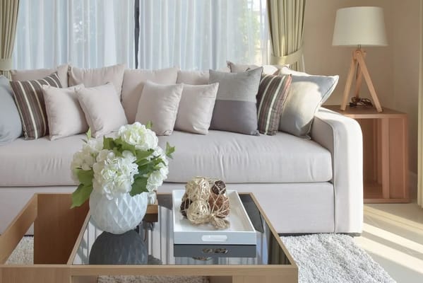Cozy living room with a sofa and decorative flowers