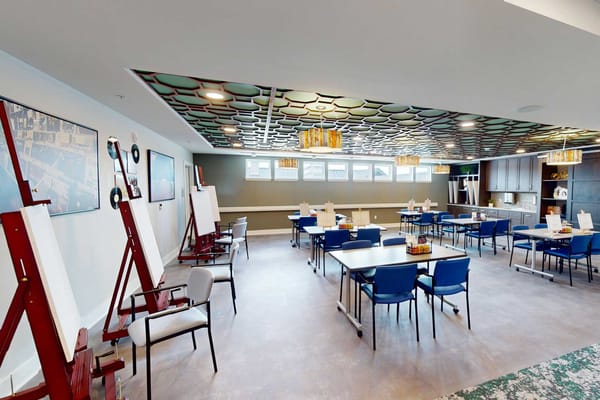 Bright activity room with tables and chairs