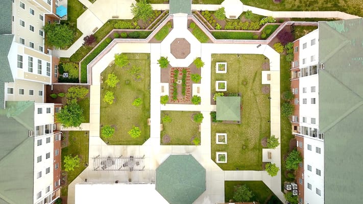 Aerial view of landscaped outdoor space with pathways and seating areas