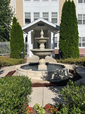 Beautiful outdoor fountain with landscaped area