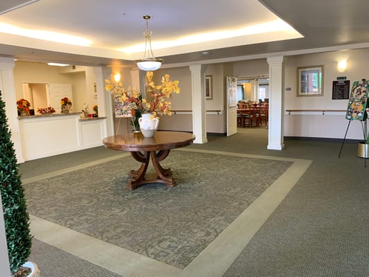Interior view of a welcoming lobby area with floral arrangement