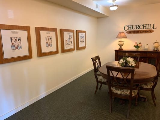 Common area with dining table and framed artwork