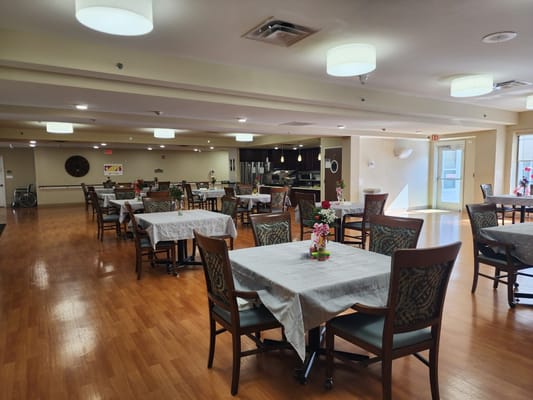 Dining area with tables set for residents