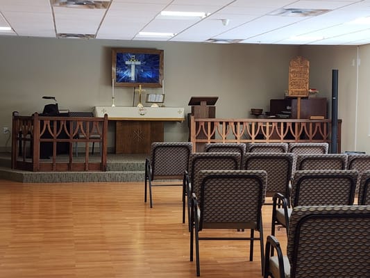 Interior of a chapel with seating and altar