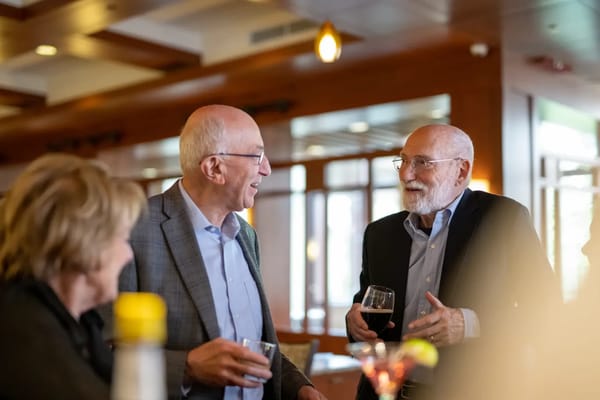 Residents enjoying drinks and conversation in a social setting