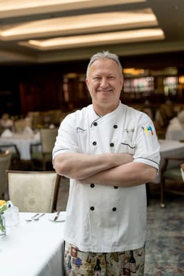 Chef standing confidently in the dining room