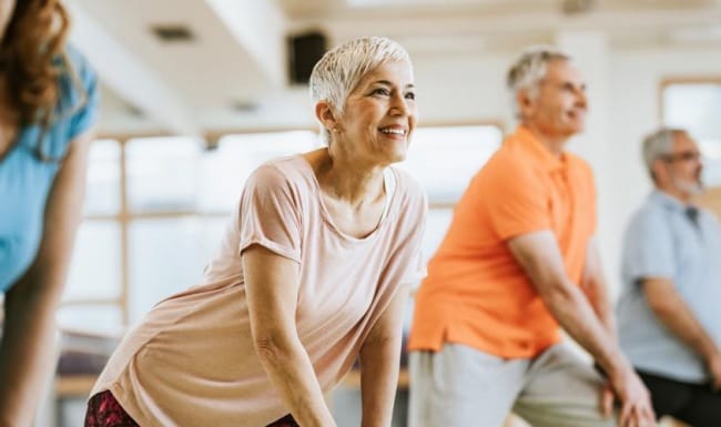 Seniors participating in a group fitness activity