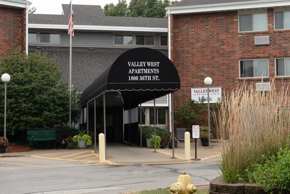 Entrance of Valley West Apartments with awning