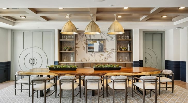 Bright dining area with a large wooden table and stylish decor