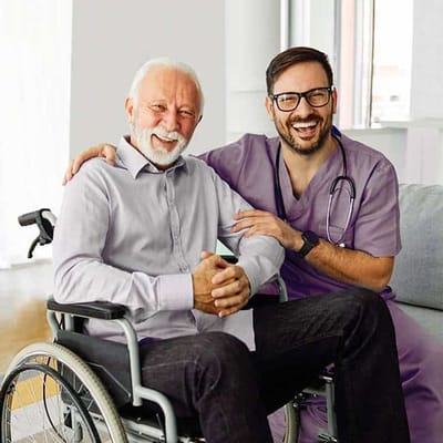 Senior resident smiling with caregiver in a bright room