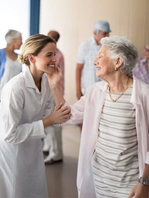Staff interacting warmly with a resident