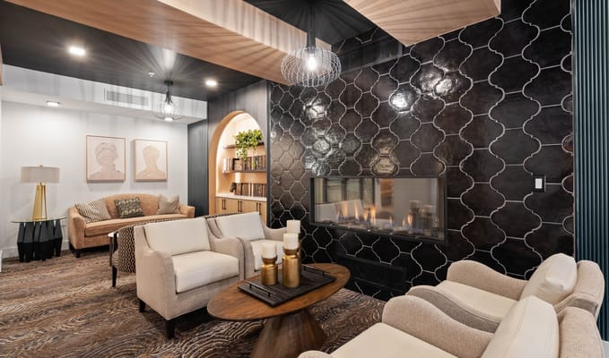 Cozy common area with modern decor and a fireplace