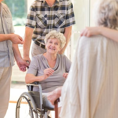 Residents socializing and laughing in a common area