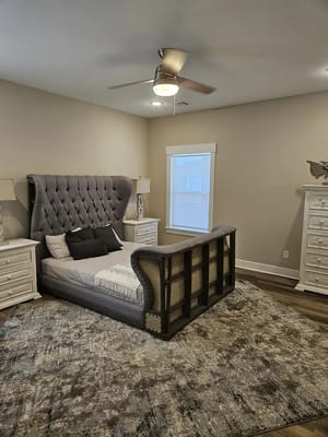 Well-furnished private resident room with a bed and decor
