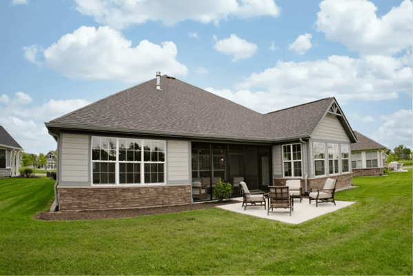 Outdoor patio area with seating at a senior living facility