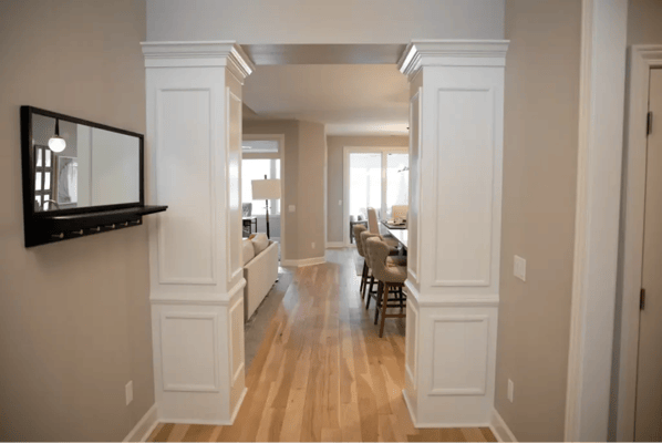 Interior view of a hallway leading to a living space