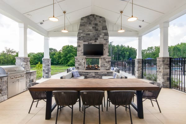 Outdoor gathering space with gas grill and seating