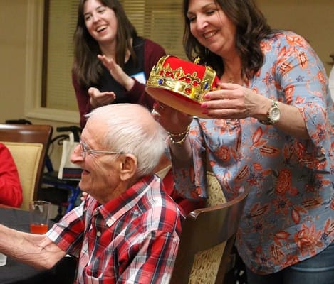 Celebration event with a resident receiving a crown