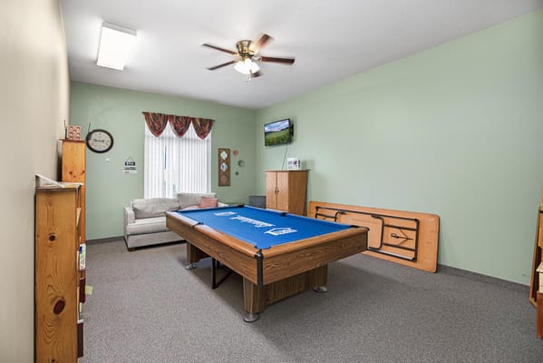 Common area with a pool table and seating