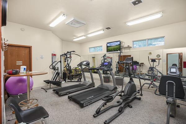 A well-equipped fitness room with exercise machines