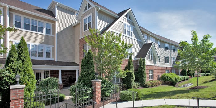 Exterior view of Willows Senior Community showing landscaped grounds