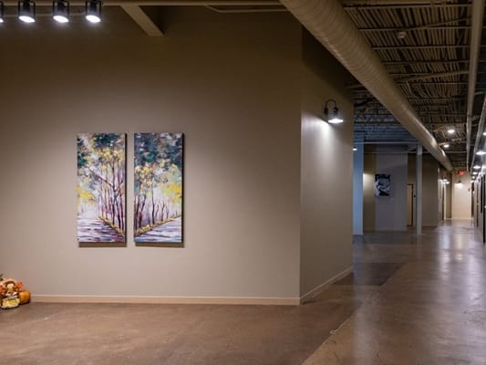 Interior hallway with artwork and decor