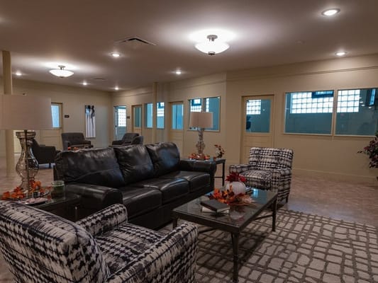 Common area seating in a well-lit lounge
