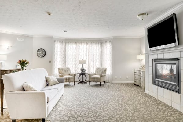 Cozy living room with comfortable seating and a fireplace