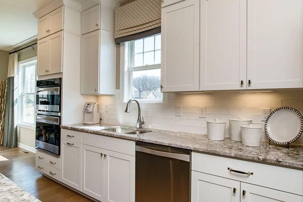 Modern kitchen interior with white cabinetry