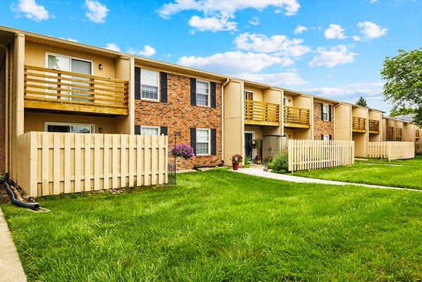 Exterior view of the assisted living facility with green lawn