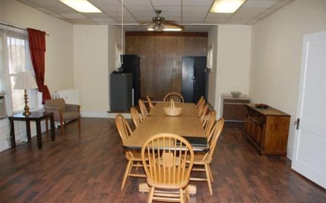 Spacious common area with a dining table and seating
