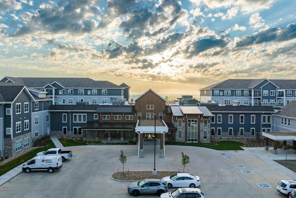 Aerial view of HallMar Village facility with sunset