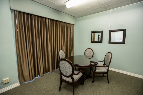 A small dining area with a round table and chairs