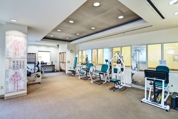 Interior view of the gym with exercise equipment at St. John Of God Retirement.