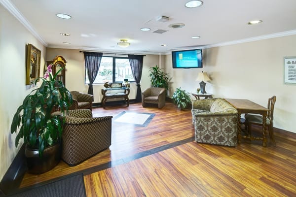 Lounge area with seating and a table in St. John Of God Retirement facility