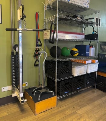 Exercise equipment with a weight machine and storage shelves