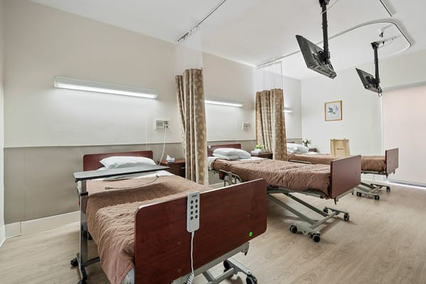 Interior view of a resident room with adjustable beds