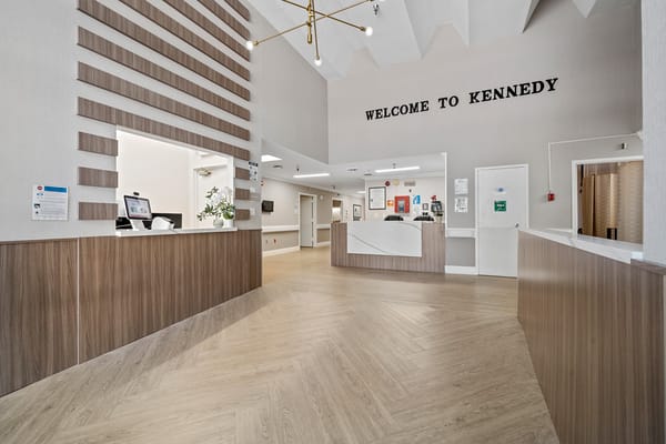 Bright reception area with modern design and welcoming sign