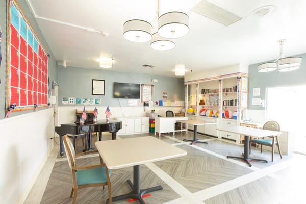 Interior of a common area with tables and decorations